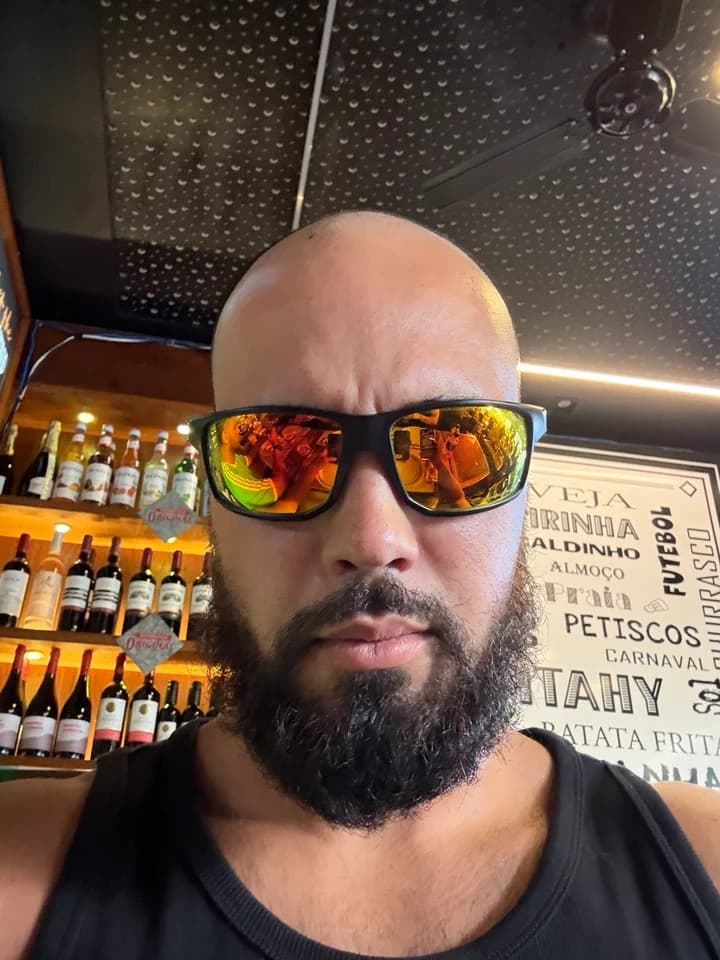 Anthony G. wearing his black sunglasses with gold mirrored lenses
